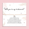 Bridesmaid proposal bracelet with silver bow charm on adjustable cord, presented on sentimental poem card. Perfect jewellery gift for proposal gift boxes and bridal party keepsakes