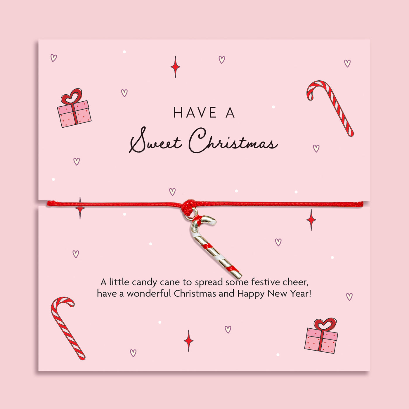 Pink Christmas card with festive illustrations and adjustable bracelet featuring a silver candy cane charm, gift idea for Secret Santa or stocking filler.