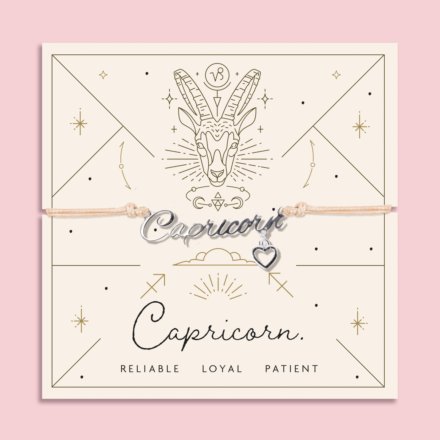 Adjustable peach cord bracelet with a silver 'Capricorn' charm and heart pendant, displayed on a zodiac-themed card featuring a goat illustration and traits reading 