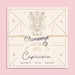 Adjustable peach cord bracelet with a silver 'Capricorn' charm and heart pendant, displayed on a zodiac-themed card featuring a goat illustration and traits reading 