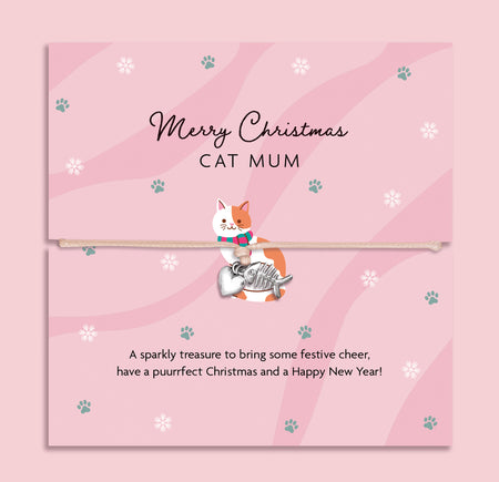Merry Christmas Cat Mum bracelet featuring a silver plated cat and heart charm on an adjustable cord, presented on a festive pink card with paw prints, snowflakes, and a cat illustration. Wrapped in soft tissue paper for gifting. Perfect Christmas jewellery gift for cat mums, stocking filler for pet lovers, or Secret Santa present. A thoughtful festive bracelet and keepsake celebrating the love between cats and their owners.