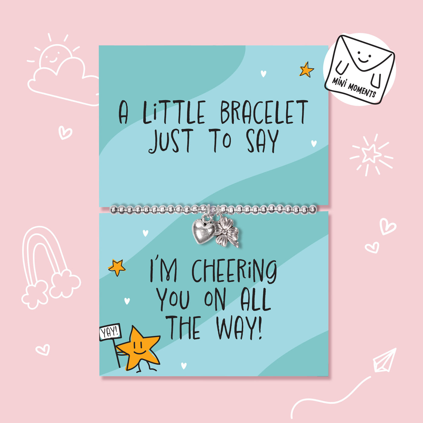 A silver bracelet with a heart and star charm displayed on a light blue greeting card that reads 'A LITTLE BRACELET JUST TO SAY' and 'I'M CHEERING YOU ON ALL THE WAY!'. The card is centered on a pink background with cute doodle illustrations.