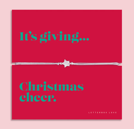 Christmas Cheer star bracelet featuring a sparkling cubic zirconia star charm on an adjustable bracelet, presented on a bold red Christmas card with the message “It’s giving… Christmas cheer.” Arrives gift wrapped, ready for Christmas gifting. A fun and thoughtful festive jewellery gift, perfect as a stocking filler.