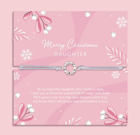 Silver daughter bracelet on a pink card with Christmas-themed decorations and meaningful text. Cubic zirconia bracelet for a daughter under £20