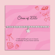 Silver plated beaded elasticated bracelet with cubic zirconia star charm displayed on a pink “Class of 2026” graduation message card, graduation keepsake jewellery gift.