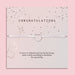 Letterbox Love 'Congratulations' bracelet – delicate silver heart charm on a white cord, presented on a pink confetti card with a champagne bottle design and celebratory message. A thoughtful letterbox gift for graduation, new job, engagement or promotion. Affordable jewellery gift to mark a special milestone for her.