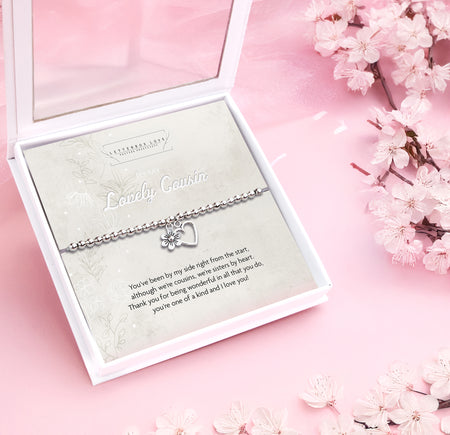 Silver beaded bracelet with heart and flower charms, presented in a white gift box with a sentimental card titled 