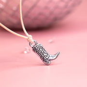 Cute charm cowboy boot with rodeo details on a beige cord. Great gift for hen party favours.