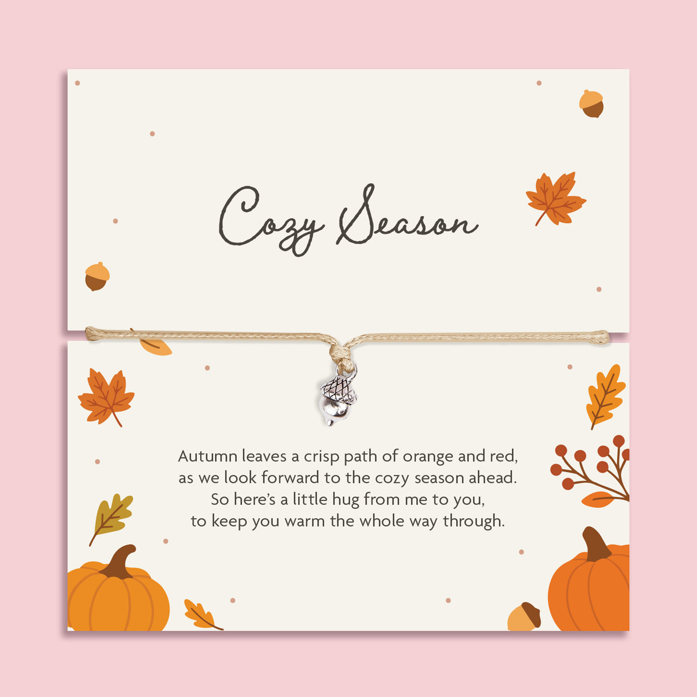 Adjustable neutral cord bracelet with silver-tone acorn charm displayed on a Cozy Season autumn sentiment card with pumpkins, leaves and a heartfelt friendship poem