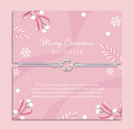 Silver daughter bracelet on a pink card with Christmas-themed decorations and meaningful text. Cubic zirconia bracelet for a daughter under £20