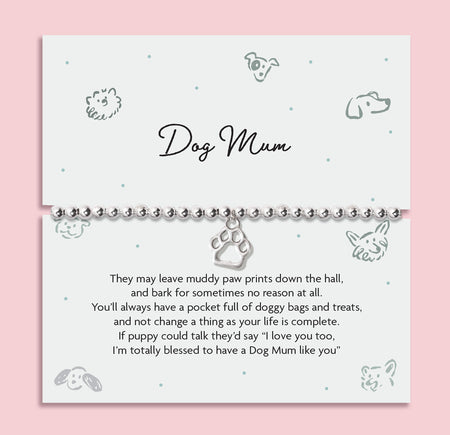 A pink background with an illustrated dog poem card with thoughtful poem about being a Dog Mum. The bracelet around the card is a silver-plated beaded bracelet with a cute dog paw charm.