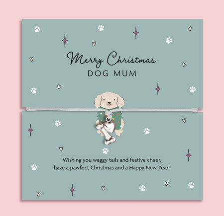 Merry Christmas Dog Mum bracelet featuring a silver plated bone and heart charm on an adjustable cord, presented on a festive card with paw prints, stars, and a cute dog illustration. Perfect Christmas jewellery gift for dog mums, stocking filler for pet lovers, or Secret Santa present. A thoughtful festive bracelet for celebrating the bond between pets and their owner.