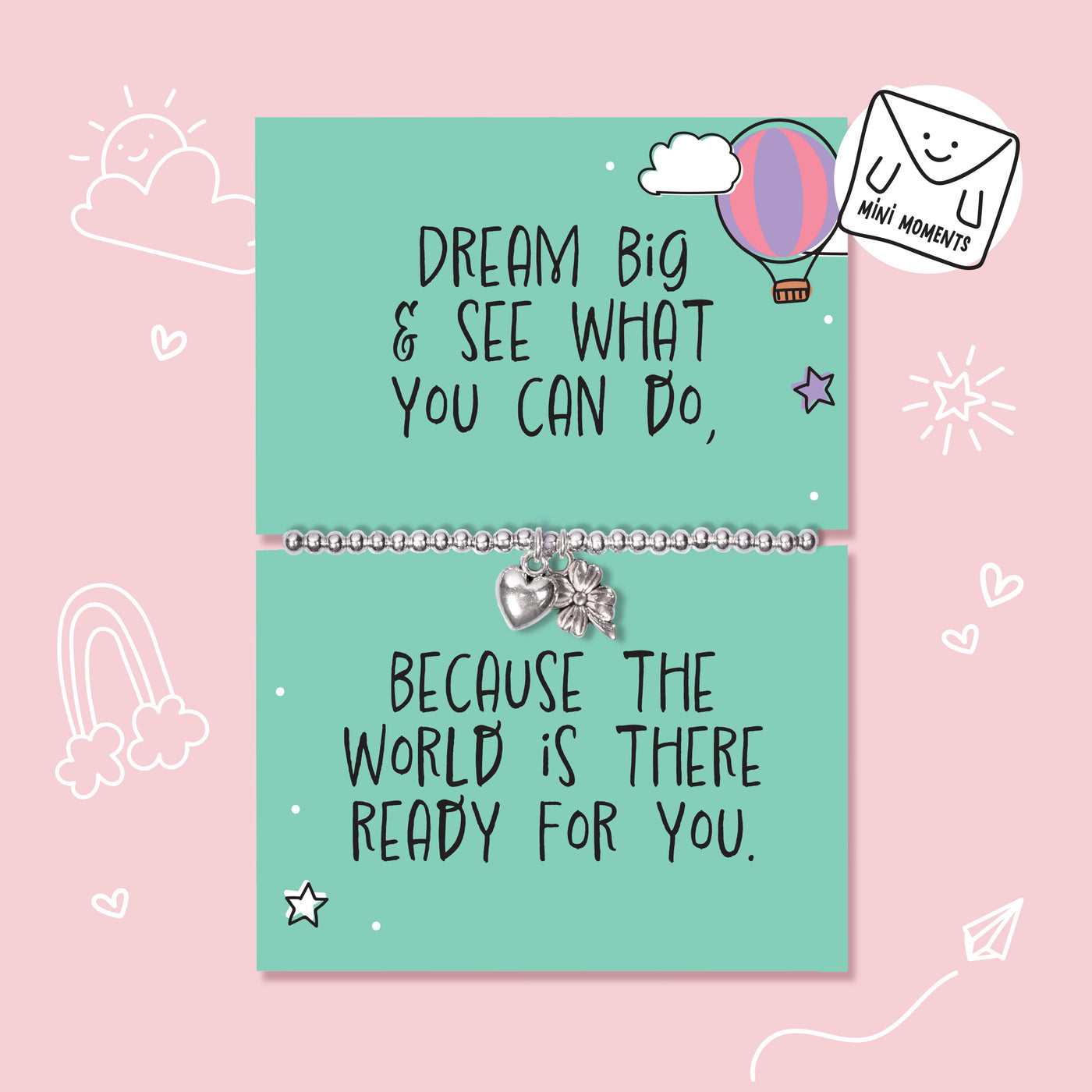 A mint green card bracelet set with motivational quotes, displayed on a pink background with hand-drawn doodles. The top card reads 'DREAM BIG & SEE WHAT YOU CAN DO,' with a silver beaded bracelet and small heart and star charms.