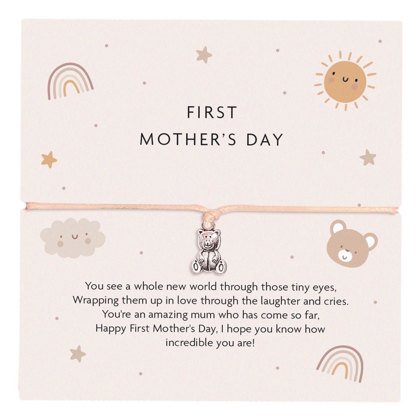 First Mother's Day bracelet featuring a cute teddy bear charm on a peach-coloured cord, with a soft pastel card design including a rainbow, sun, cloud, and bear illustrations. The card reads a heartfelt message for a first-time mother.