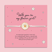 Card with a daisy bracelet and text asking if you will be the flower girl on a pink background. An affordable gift to ask someone to be your flower girl