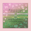 For Good Friendship Bracelet gift set with two interlocking heart charms on pastel adjustable cords, displayed on a card with friendship poem – meaningful best friend jewellery gift under £15.