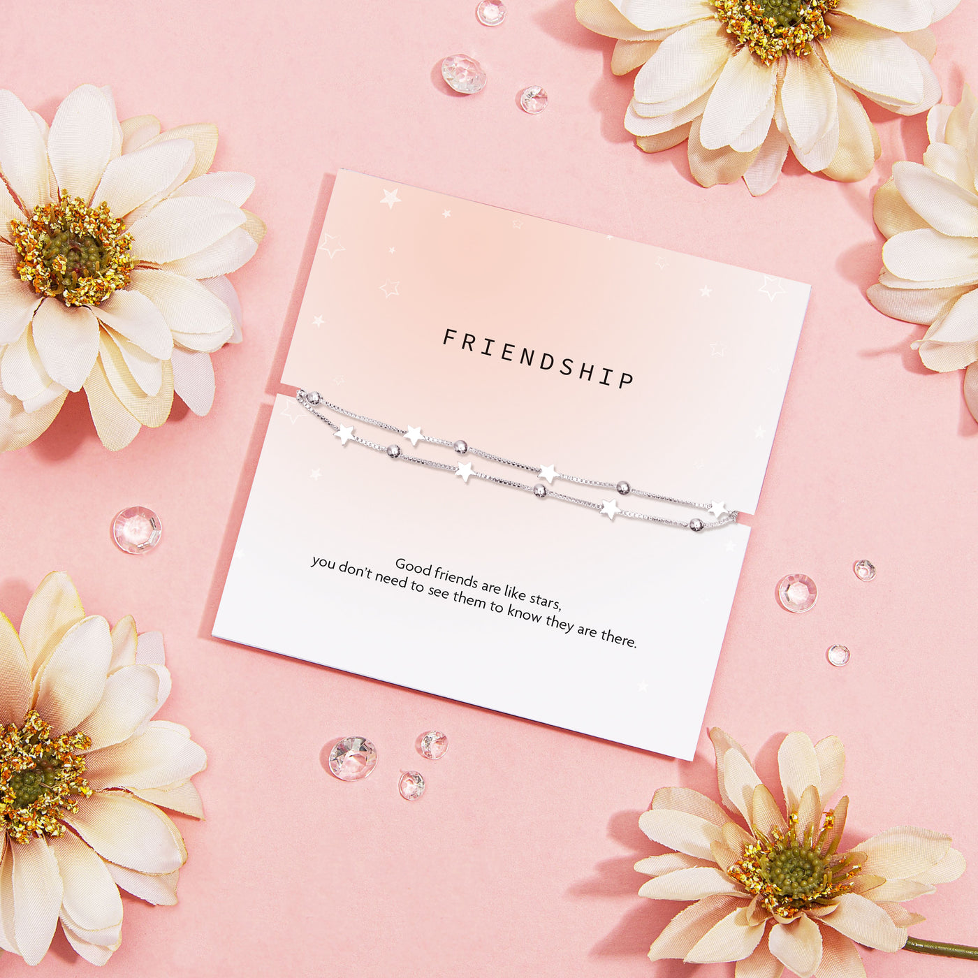 Silver bracelet on a 'Friendship' card with decorative flowers and crystals on a pink background. An affordable jewellery gift for a best friend