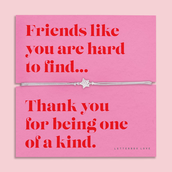 Friendship bracelet for a best friend on a pink and red card. Cute star bracelet on grey string.