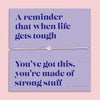 A lavender-colored bracelet card titled 