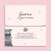 Good luck exam bracelet with open book charm on adjustable cord, displayed on a motivational exam gift card with poem, student encouragement gift