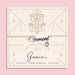 Adjustable peach cord bracelet with a silver 'Gemini' charm and heart pendant, displayed on a zodiac-themed card with a twin illustration and the traits 