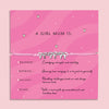 Pink adjustable cord bracelet with four silver bow charms, presented on a card reading “A Girl Mum Is” with messages about strength, inspiration, resilience, and love — a meaningful gift for mums of girls.