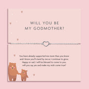 Silver heart charm bracelet displayed on a pink proposal card reading "Will You Be My Godmother?" with a heartfelt poem and illustrated bear characters, ideal for a sentimental godmother proposal gift.