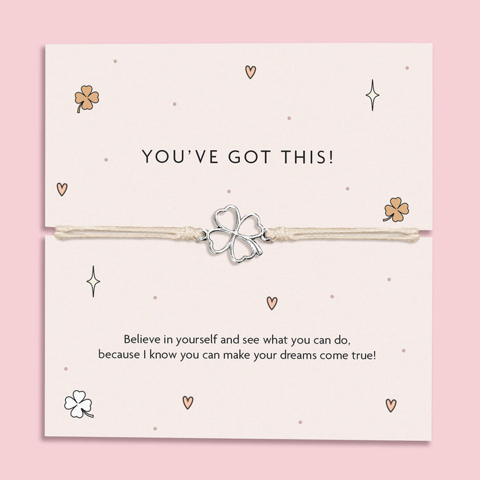 Silver-plated four-leaf clover charm bracelet on a "You’ve Got This!" motivational card with a pink background and daisies. Perfect for inspiring confidence, this charm bracelet makes a thoughtful gift for someone in need of a little encouragement, featuring positive affirmations for women, friends, and those facing challenges.