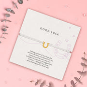 Good luck poem card with a gold lucky horseshoe charm on a pink background. A cute gift to wish someone luck. Good luck friendship bracelet under £10