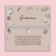 Graduation-themed card with decorative elements and a message on a pink background. The bracelet is a silver-plated star bracelet