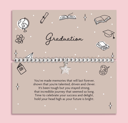 Graduation-themed card with decorative elements and a message on a pink background. The bracelet is a silver-plated star bracelet