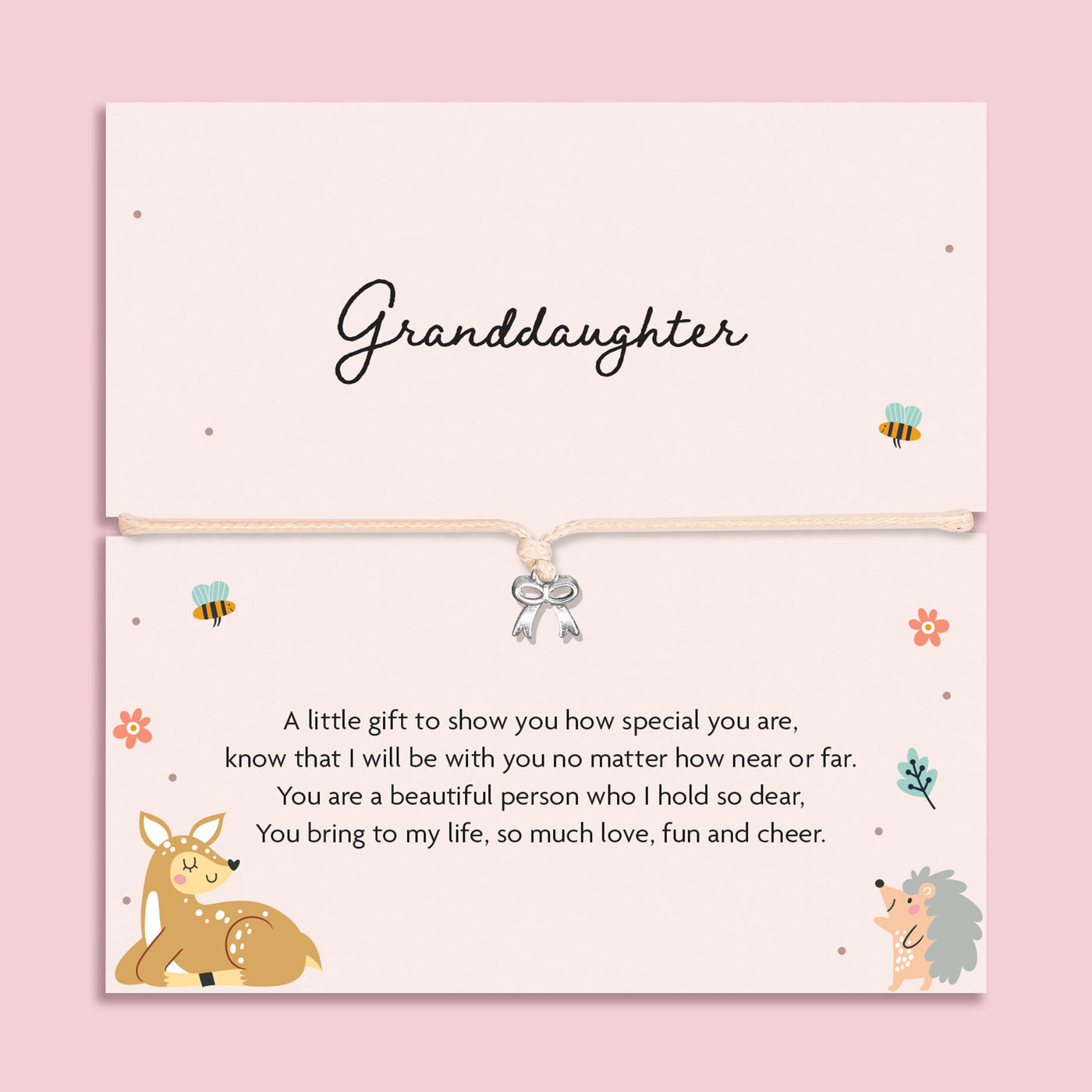 Silver bow charm bracelet on a  beige cord, displayed on a pastel card with cute woodland animals and a sentimental message for a granddaughter.