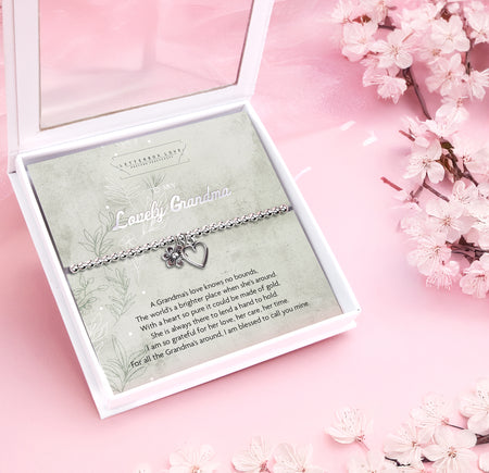 Silver beaded bracelet with heart and flower charms, presented in a white gift box with a sentimental card reading 