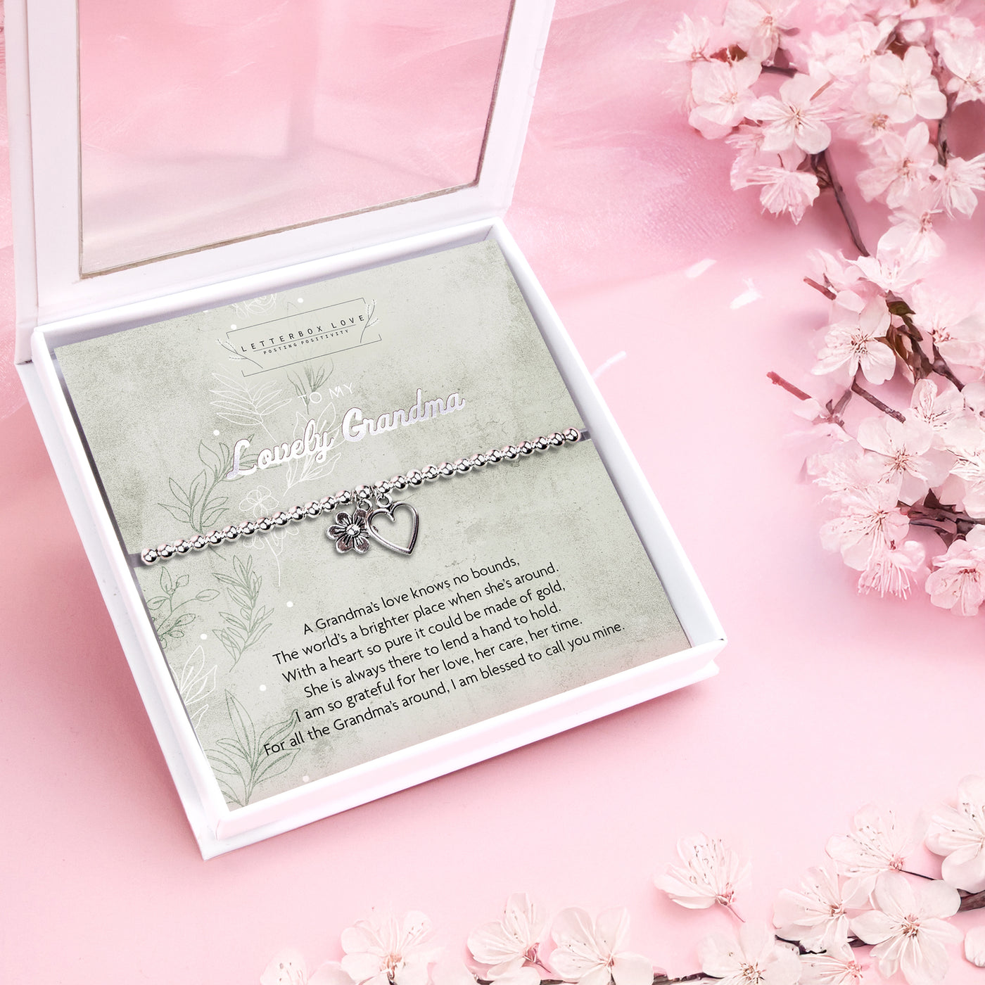 Silver beaded bracelet with heart and flower charms, presented in a white gift box with a sentimental card reading 