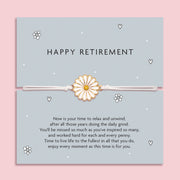 Happy Retirement Daisy Bracelet with a delicate daisy charm on an adjustable white cord, set on a blue card with a heartfelt retirement message. An ideal gift for a retiring friend or family member.