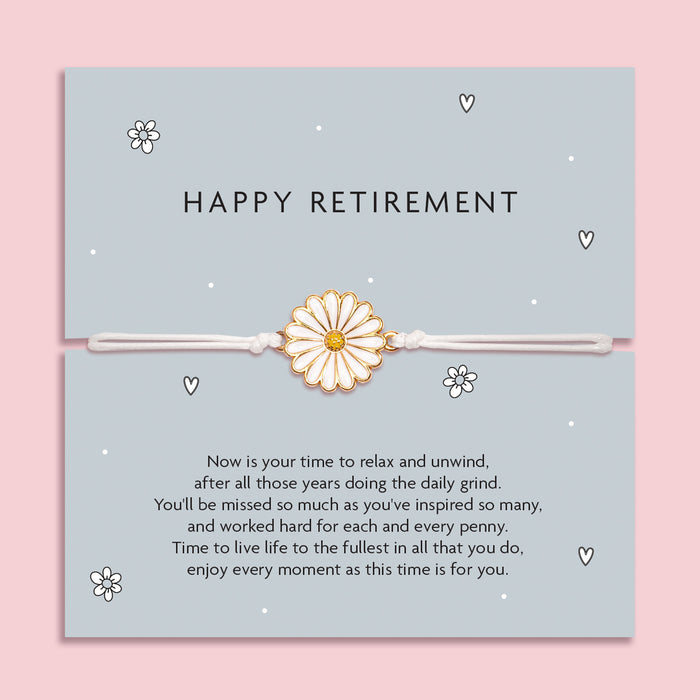 Happy Retirement Daisy Bracelet with a delicate daisy charm on an adjustable white cord, set on a blue card with a heartfelt retirement message. An ideal gift for a retiring friend or family member.
