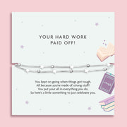 A well done gift to celebrate how hard they worked in exams. The poem card is a pale blue with purple book details. The gift is a beautiful silver-plated star bracelet.