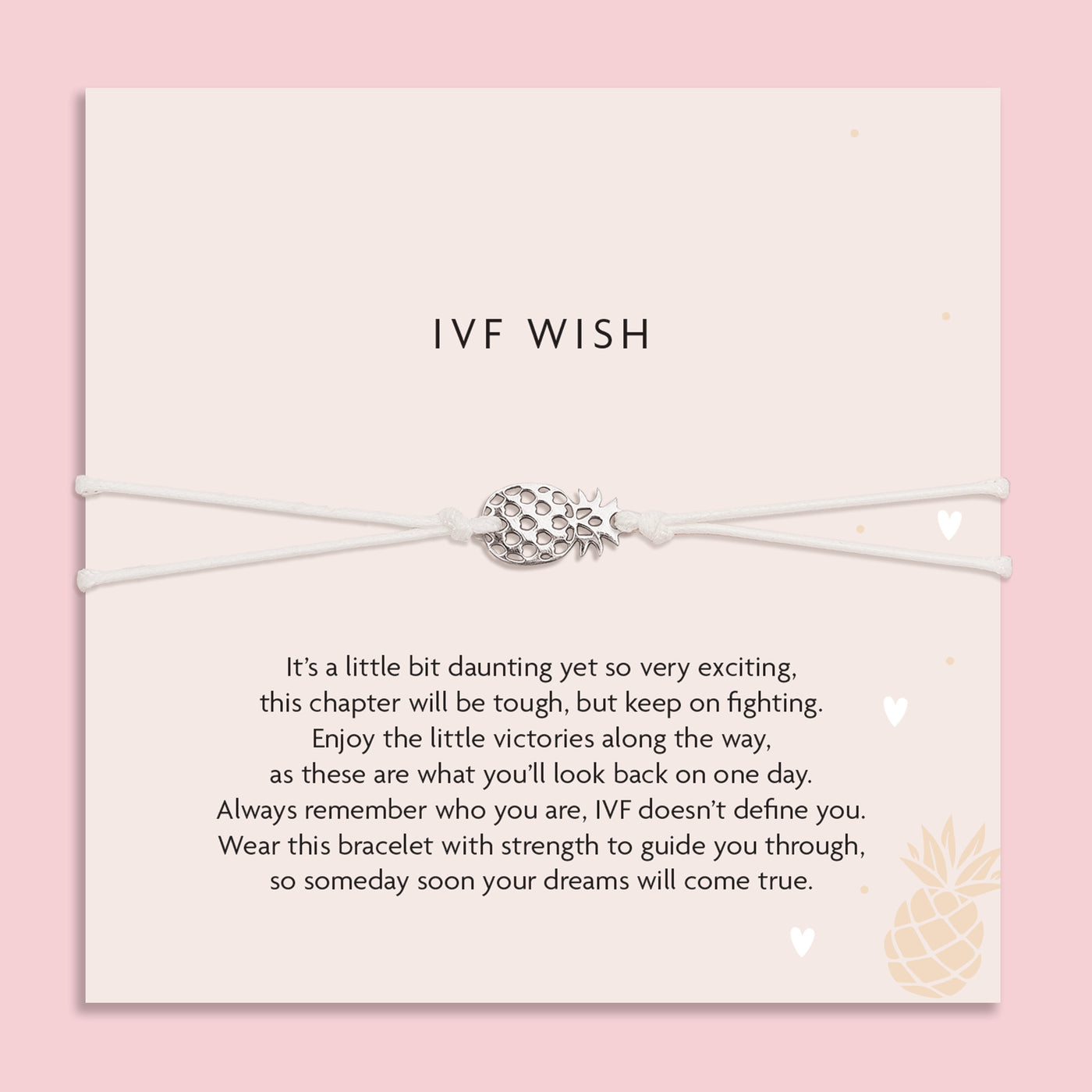 Bracelet with pineapple charm on a card with 'IVF Wish' text against a pink background. A gift for someone beginning IVF.