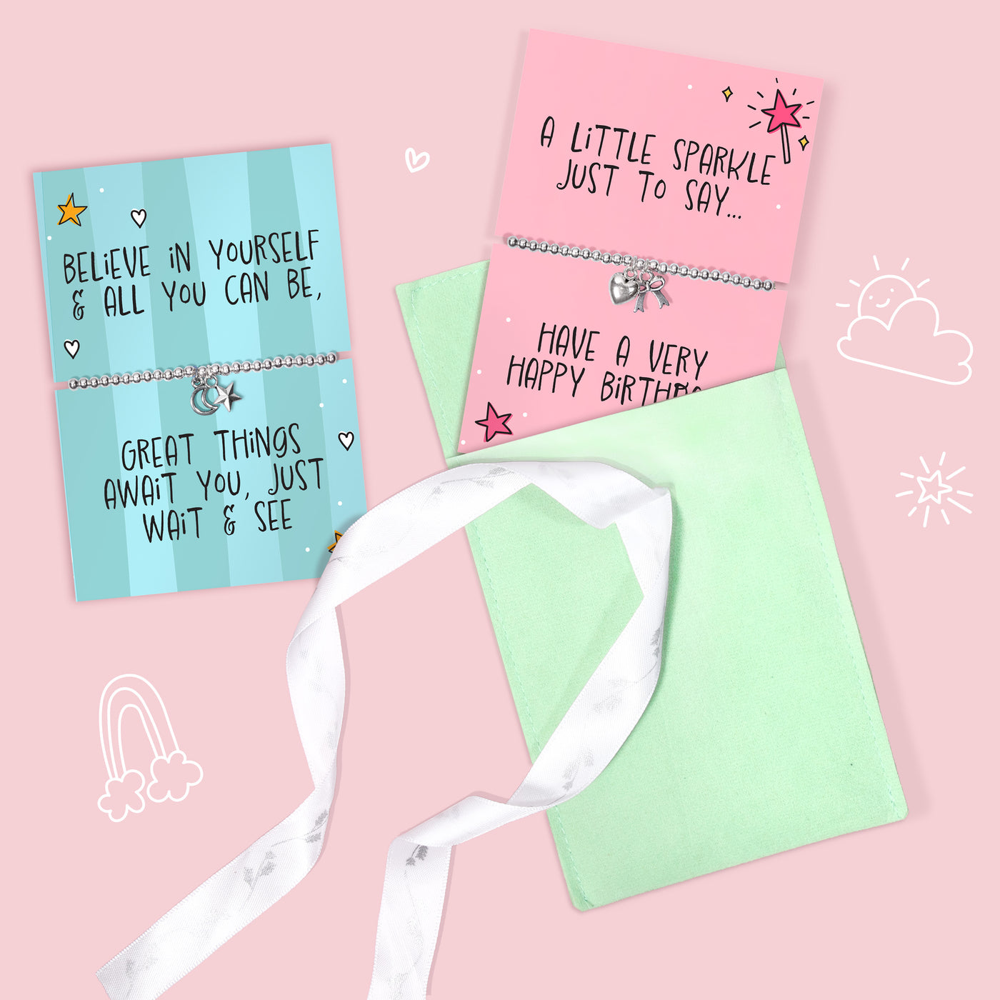 Two meaningful children's gifts with silver-toned bracelets and small charms, displayed on pastel pink and light blue cards with a white ribbon pouch, on a pink background with cute doodles.