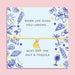 Yellow cord bracelet with an enamel lemon slice charm displayed on a pastel blue card with playful illustrations and the quote 