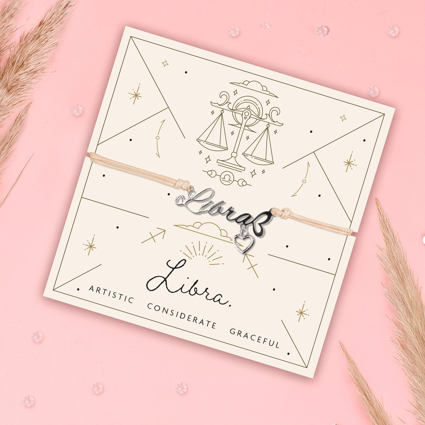 Libra bracelet with meaningful poem card on a pink background and pampus grass. Thoughtful Zodiac bracelet for a friend.