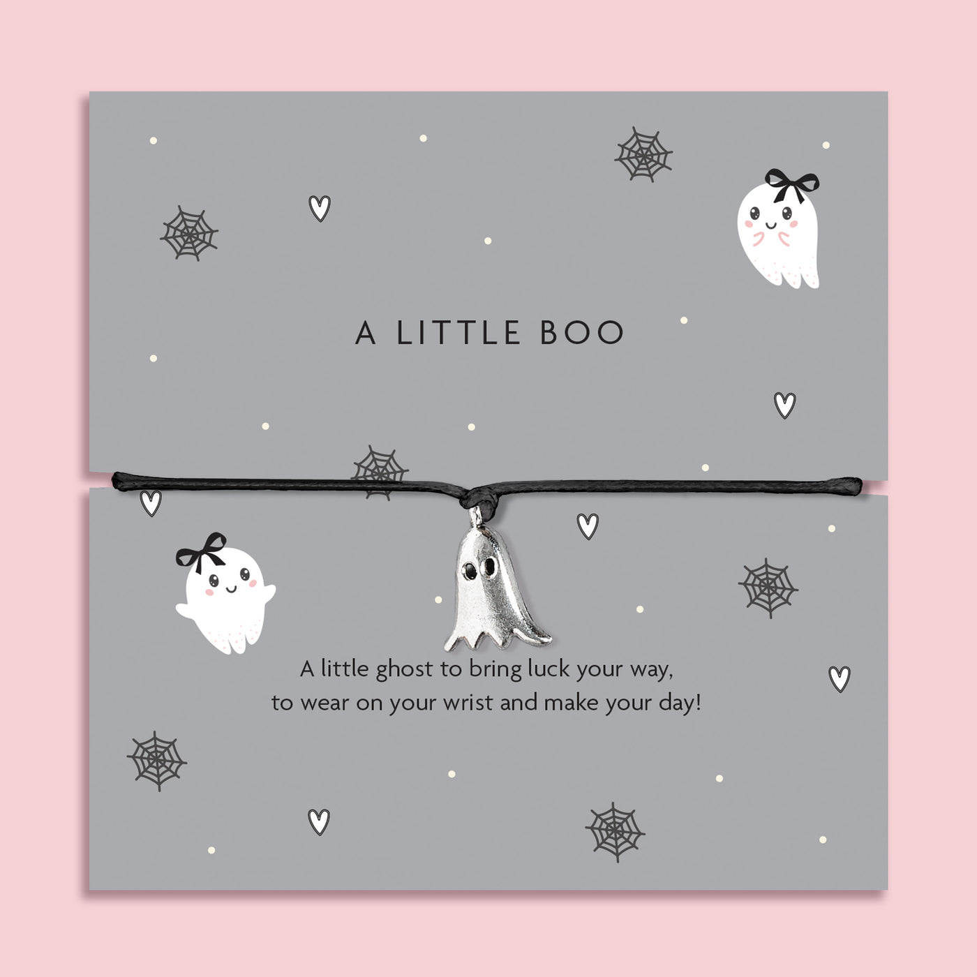 Silver ghost charm bracelet on black cord, displayed on grey Halloween-themed card with spiderweb and heart illustrations.