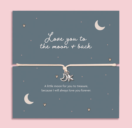 Love You to the Moon and Back bracelet with silver moon and star charms on an adjustable cord, displayed on a blue illustrated keepsake card with sentimental message