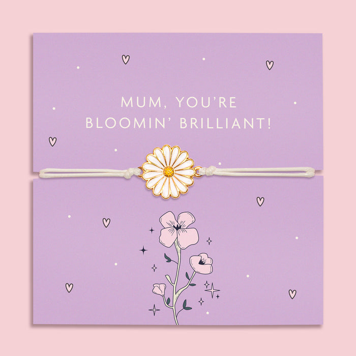 A delicate bracelet with an enamel daisy charm on an adjustable white cord, displayed on a lilac backing card with the message "Mum, You're Bloomin' Brilliant!" 