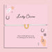 Lucky charm bracelet on a pink card with decorative elements and a horse shoe bracelet