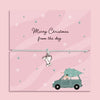 Merry Christmas from the Dog bracelet featuring a silver plated bone and heart charm on an adjustable cord, presented on a festive pink card with paw prints, snowflakes, and a dog carrying a Christmas tree illustration. Includes a soft pouch for gifting and safekeeping. Perfect Christmas jewellery gift from the dog to their owner, stocking filler for pet lovers, or sentimental festive bracelet for dog mums and dads to celebrate the bond with their furry friend.