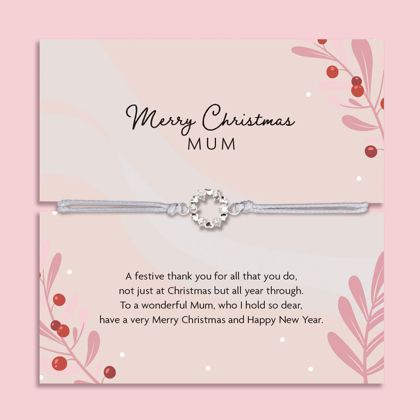 Merry Christmas Mum bracelet featuring a silver wreath charm on an adjustable cord, presented on a festive pink card with berries, leaves, and snowy details. Includes a soft white pouch for gifting and safekeeping. A sentimental Christmas jewellery gift for mum, perfect as a stocking filler, Christmas morning surprise, or meaningful keepsake to show love and appreciation during the festive season.
