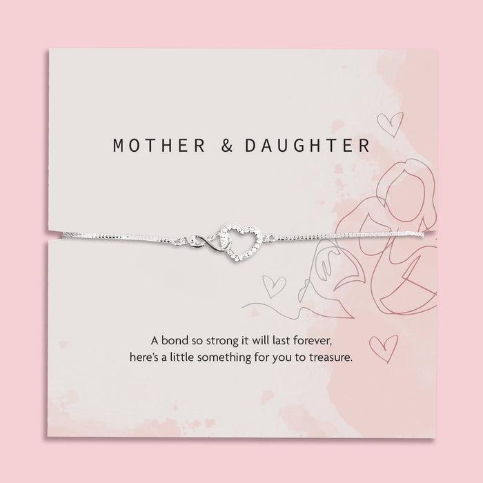 Silver heart-shaped bracelet on a 'Mother & Daughter' themed card with pink background. A silver-plated gift from Daughter to Mother Under £20