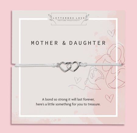 Silver bracelet with interlocking hearts on a 'Letterbox Love' card with text on a pink background. A meaningful gift under £10 for a mother and daughter