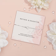 Mother and Daughter bracelet featuring a silver-tone double heart charm on a delicate adjustable chain, displayed on a pink floral card with the message “A bond so strong it will last forever, here’s a little something for you to treasure.” This sentimental jewellery gift celebrates the unbreakable bond between mother and daughter, making it a thoughtful present for birthdays, Mother’s Day, Christmas, or just because. A meaningful keepsake gift for her to cherish always.